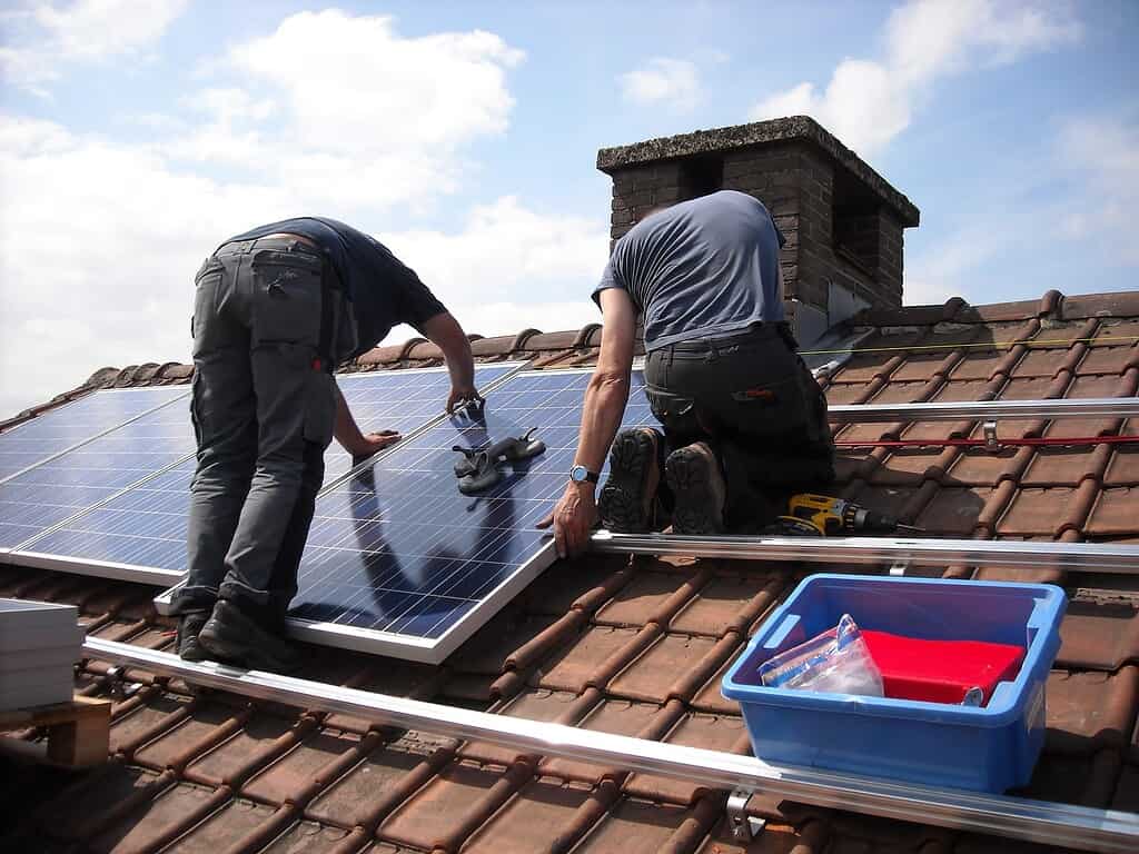 Solar panels being installed on roof